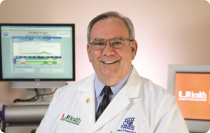 Smiling doctor in white coat in a medical office.